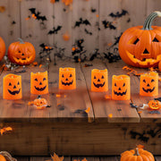 Halloween LED jack-o’-lantern candles on porch with pumpkins and bats