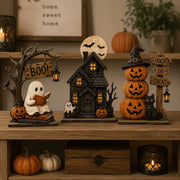 Spooky cute Halloween figurines with LED glow on a dark wood shelf