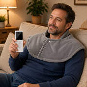 USA man on sofa — exact packing heated shawl holding white LCD remote
