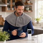 USA man in kitchen — exact packing heating shawl, white LCD remote on counter