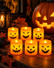 Halloween LED pumpkin candles with autumn leaves and jack-o’-lantern décor