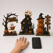 Vintage Halloween figurine set of 3 shown with hand and phone for real size scale